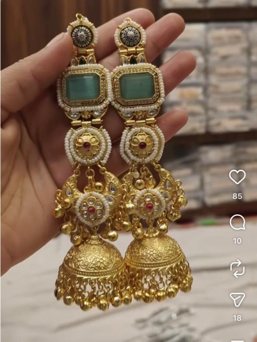 Gold-Toned Green Stone Jhumka Earrings with Pearl Accents